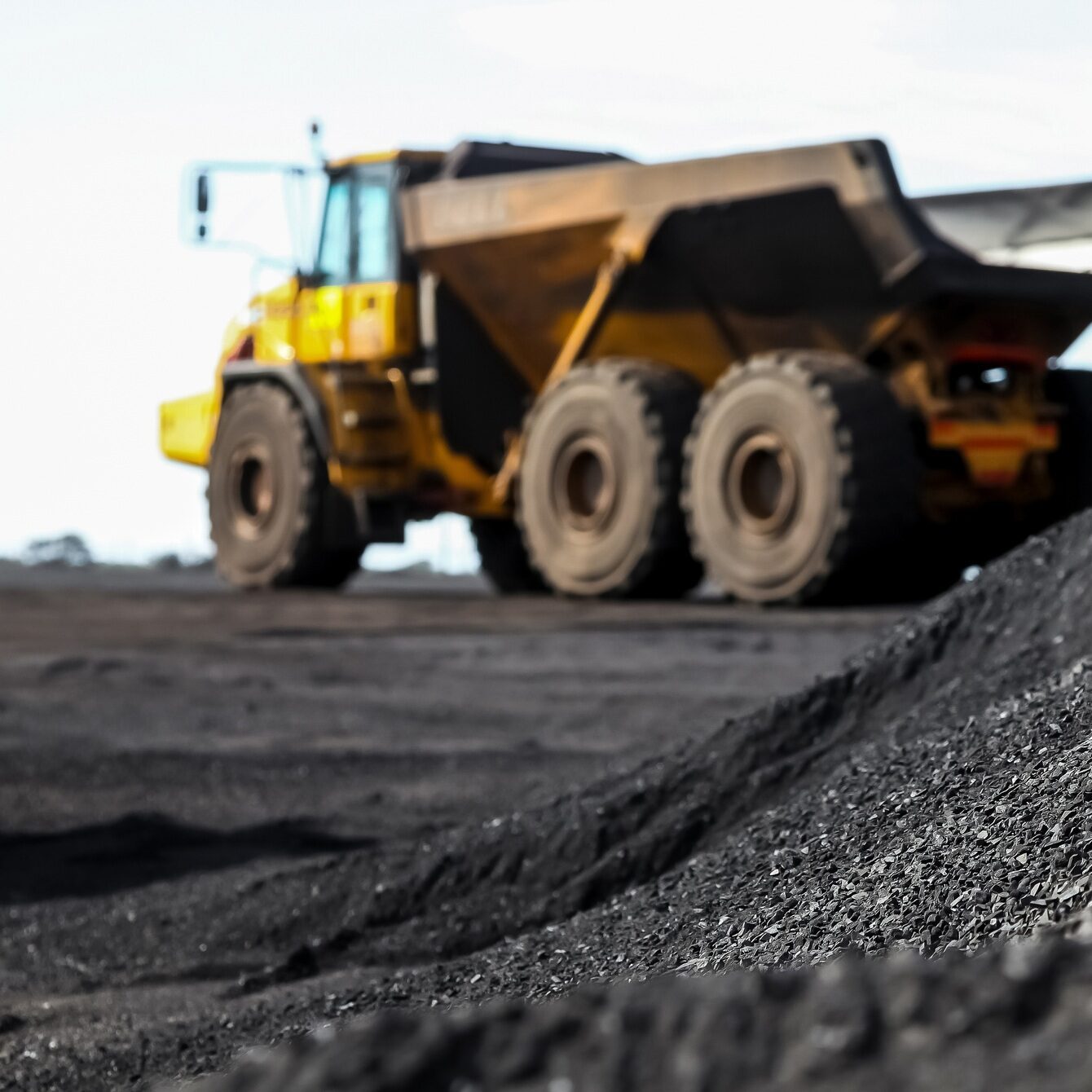 Open-pit manganese mining industry on blurred background of a machine